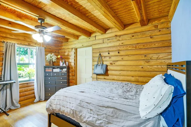 a bed room with a bed and a window