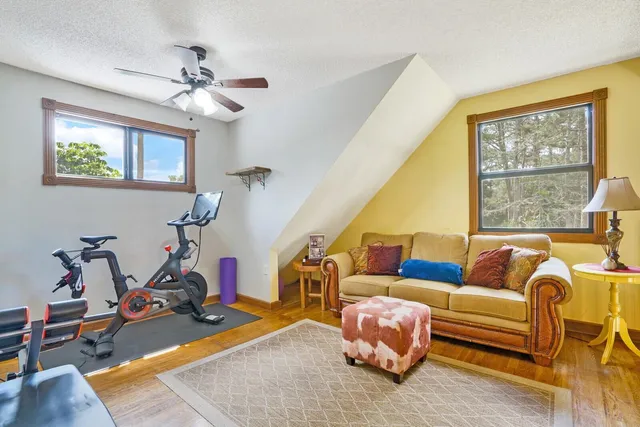 a view of a livingroom with furniture and a window