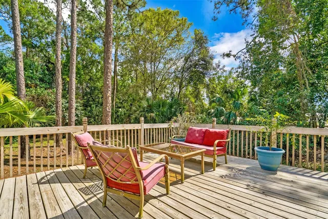 a view of sitting area with furniture on wooden deck
