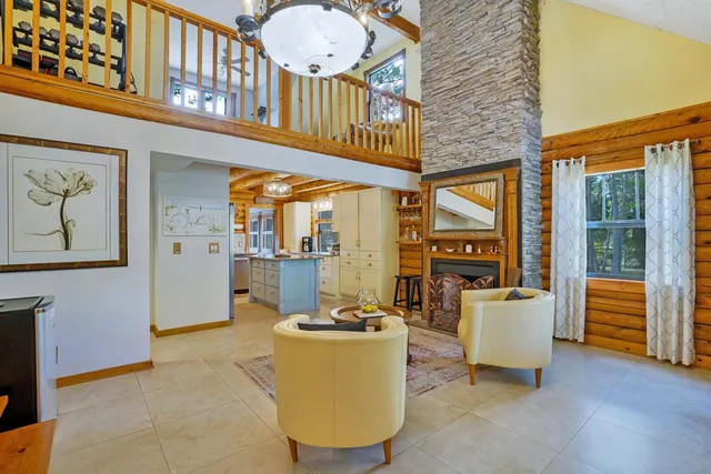 a view of kitchen with furniture and windows