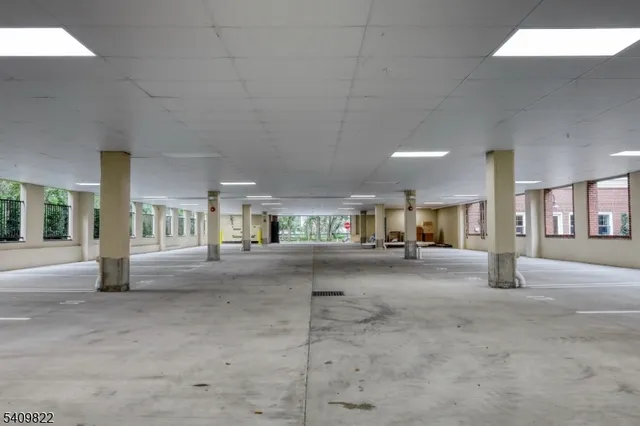 a view of a building with car parked