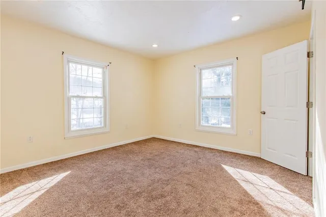 a view of an empty room with stairs