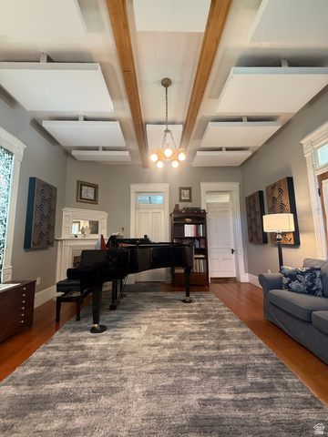541 300 North Provo, UT 84606 - Photo 17 of 36 Spacious room featuring wood-finish flooring, a decorative fireplace with a mantel, and a built-in bookcase