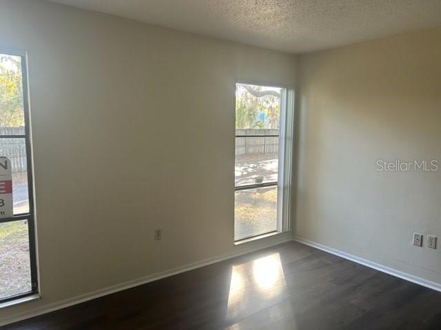 2811 Southwest Archer Road, Unit T167 Gainesville, FL 32608 - Photo 4 of 7 an empty room with windows
