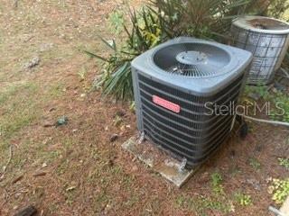 2811 Southwest Archer Road, Unit T167 Gainesville, FL 32608 - Photo 6 of 7 a front view of a house with a garden and trees