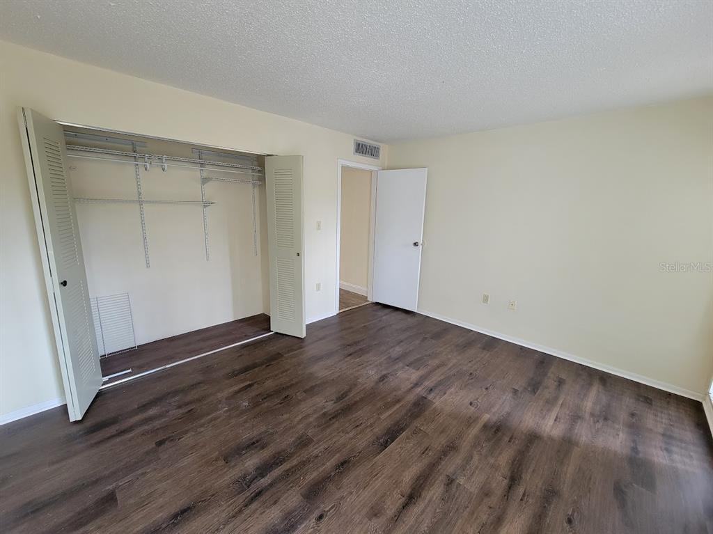 2811 Southwest Archer Road, Unit T167 Gainesville, FL 32608 - Photo 9 of 10 a view of an empty room with wooden floor