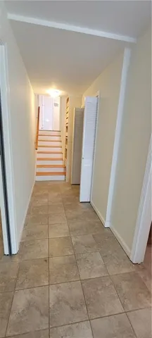 a view of entryway with stairs and a window