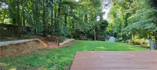 a view of a backyard with green space