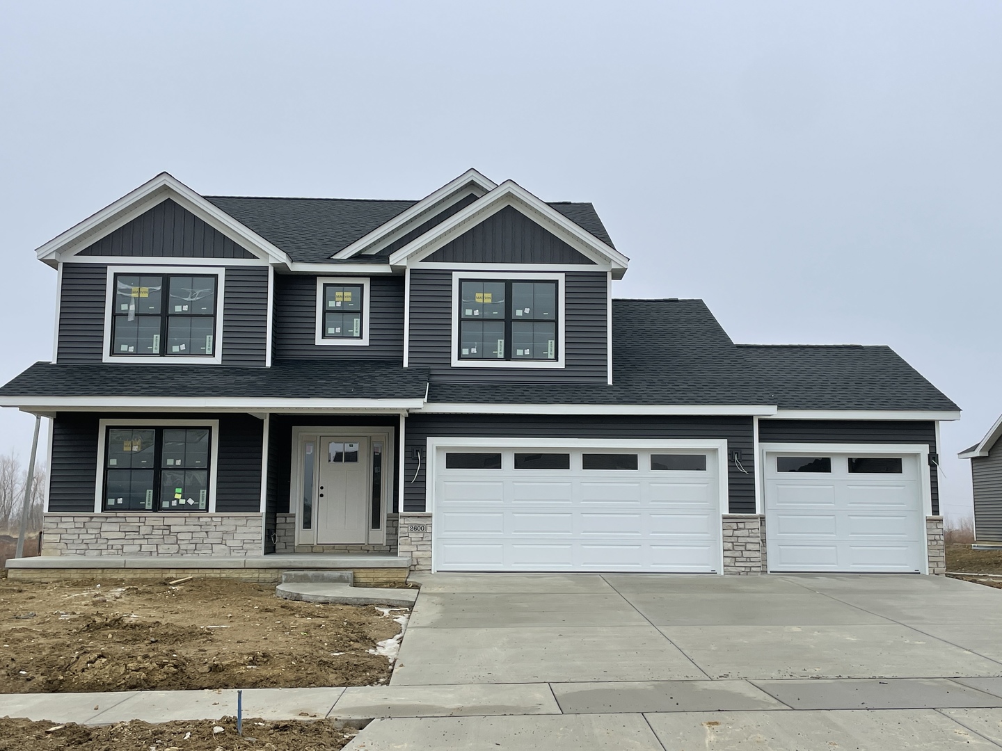 2600 Shale Road Normal, IL 61761 - Photo 1 of 4 a front view of a house with yard and garage