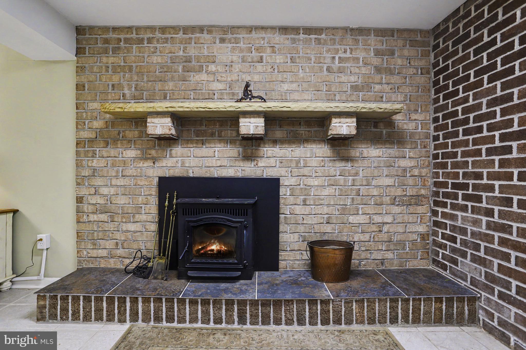 2226 Harney Road Littlestown, PA 17340 - Photo 25 of 40 a fireplace with a sink