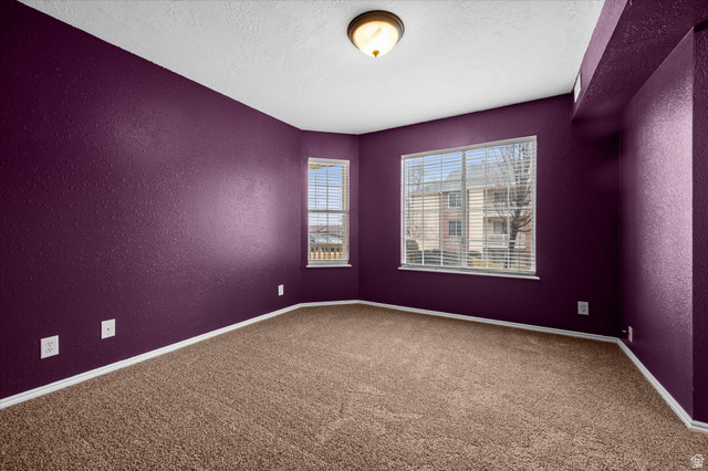 2095 South Main Street, Unit 13 Bountiful, UT 84010 - Photo 14 of 45 Carpeted spare room with a textured wall and a textured ceiling