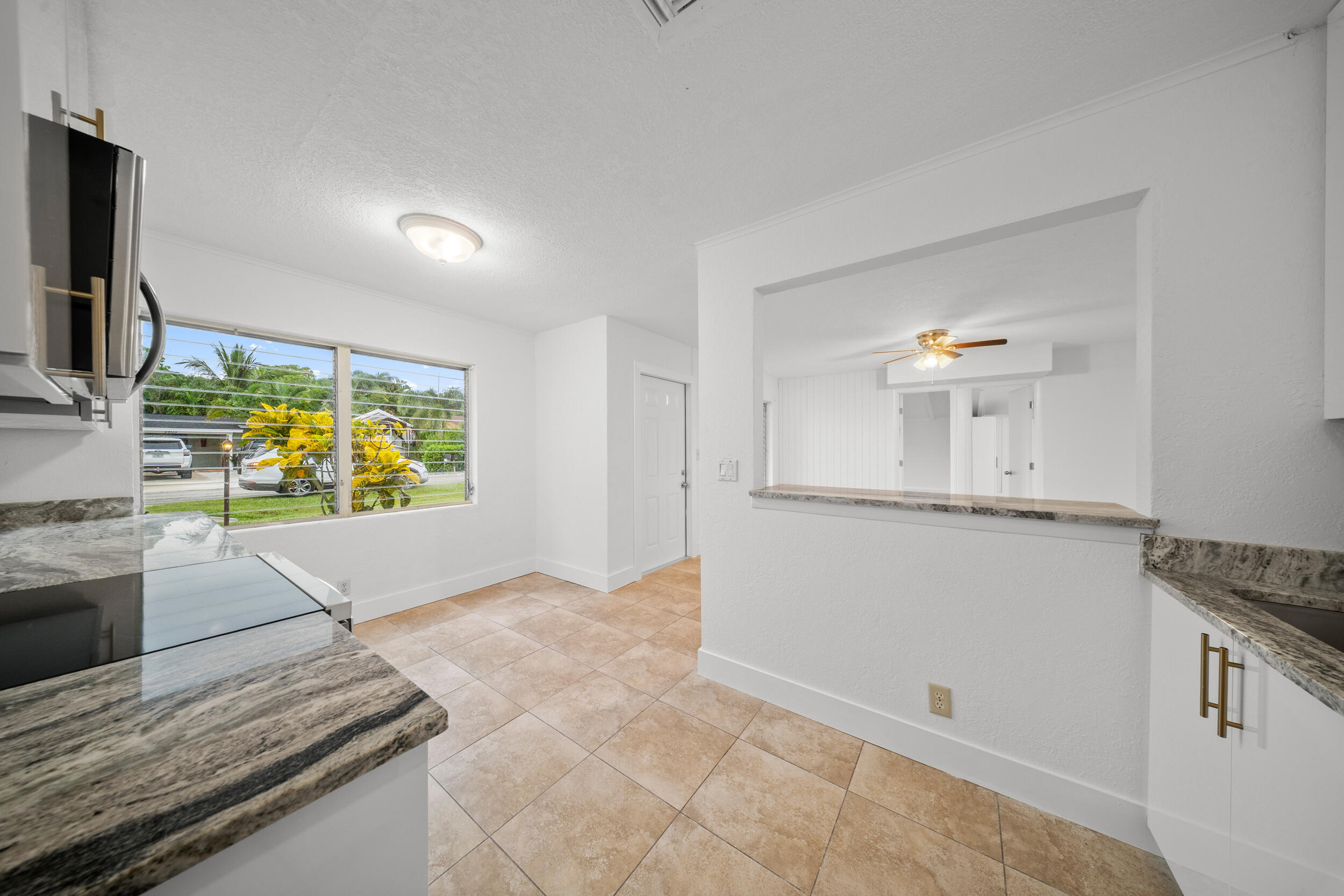 2904 Southeast Bamboo Street Stuart, FL 34997 - Photo 23 of 51 a kitchen with stainless steel appliances granite countertop a sink and a stove