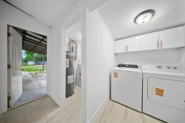 a utility room with dryer and washer