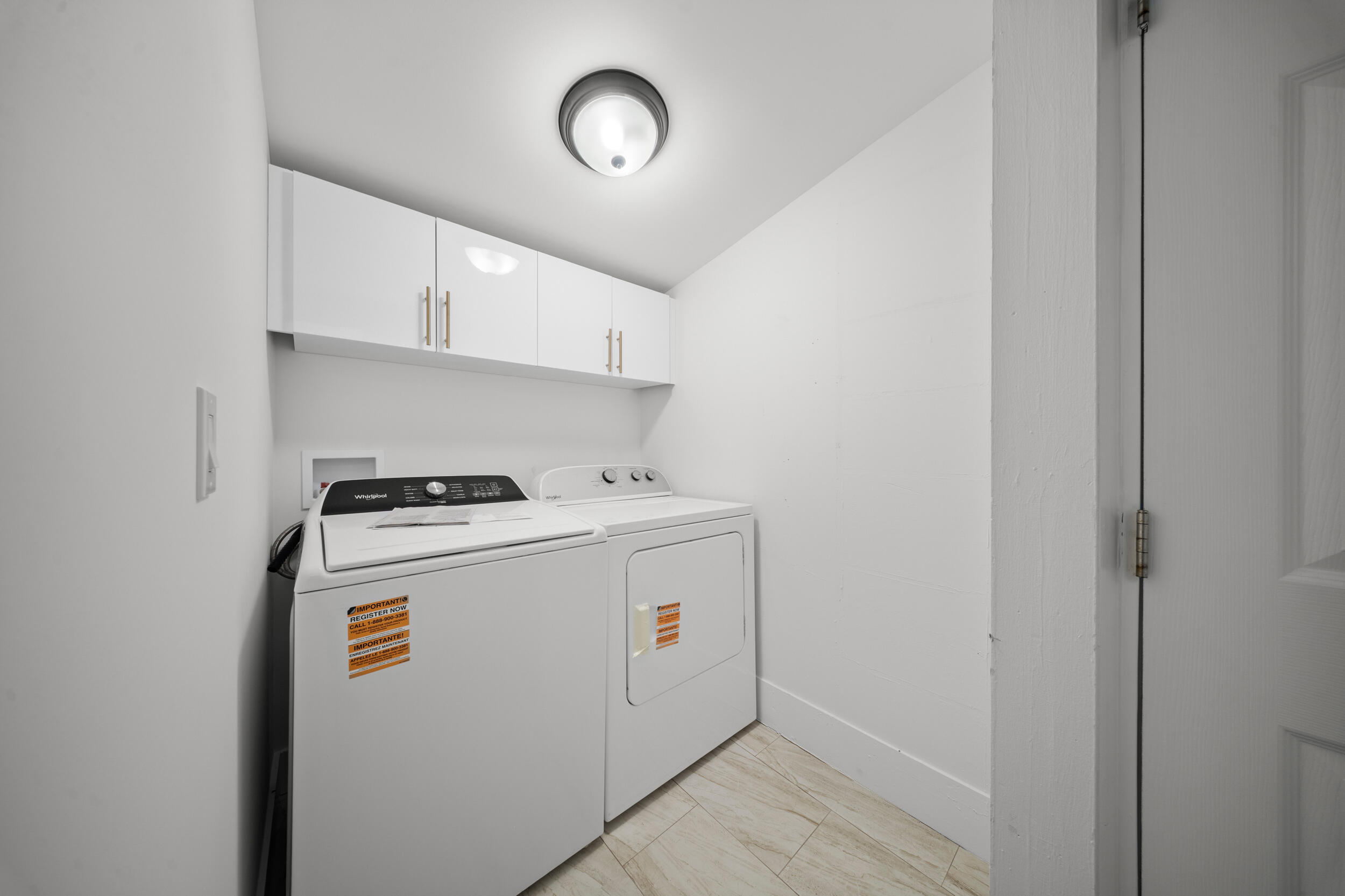 2904 Southeast Bamboo Street Stuart, FL 34997 - Photo 27 of 51 a utility room with dryer and washer
