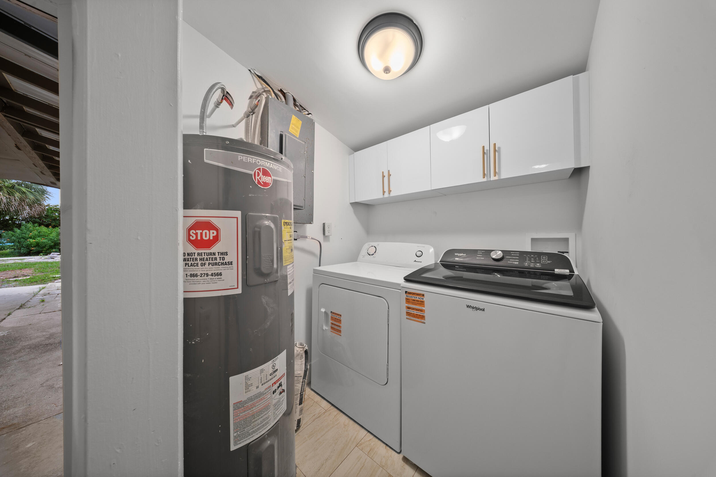 2904 Southeast Bamboo Street Stuart, FL 34997 - Photo 29 of 51 a utility room with dryer and washer