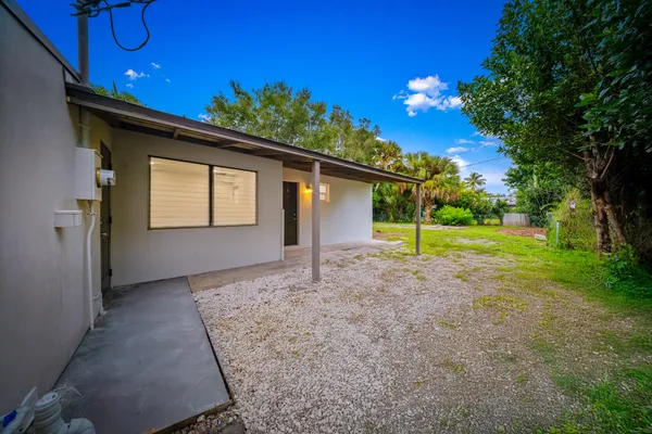 a view of a house with a tree