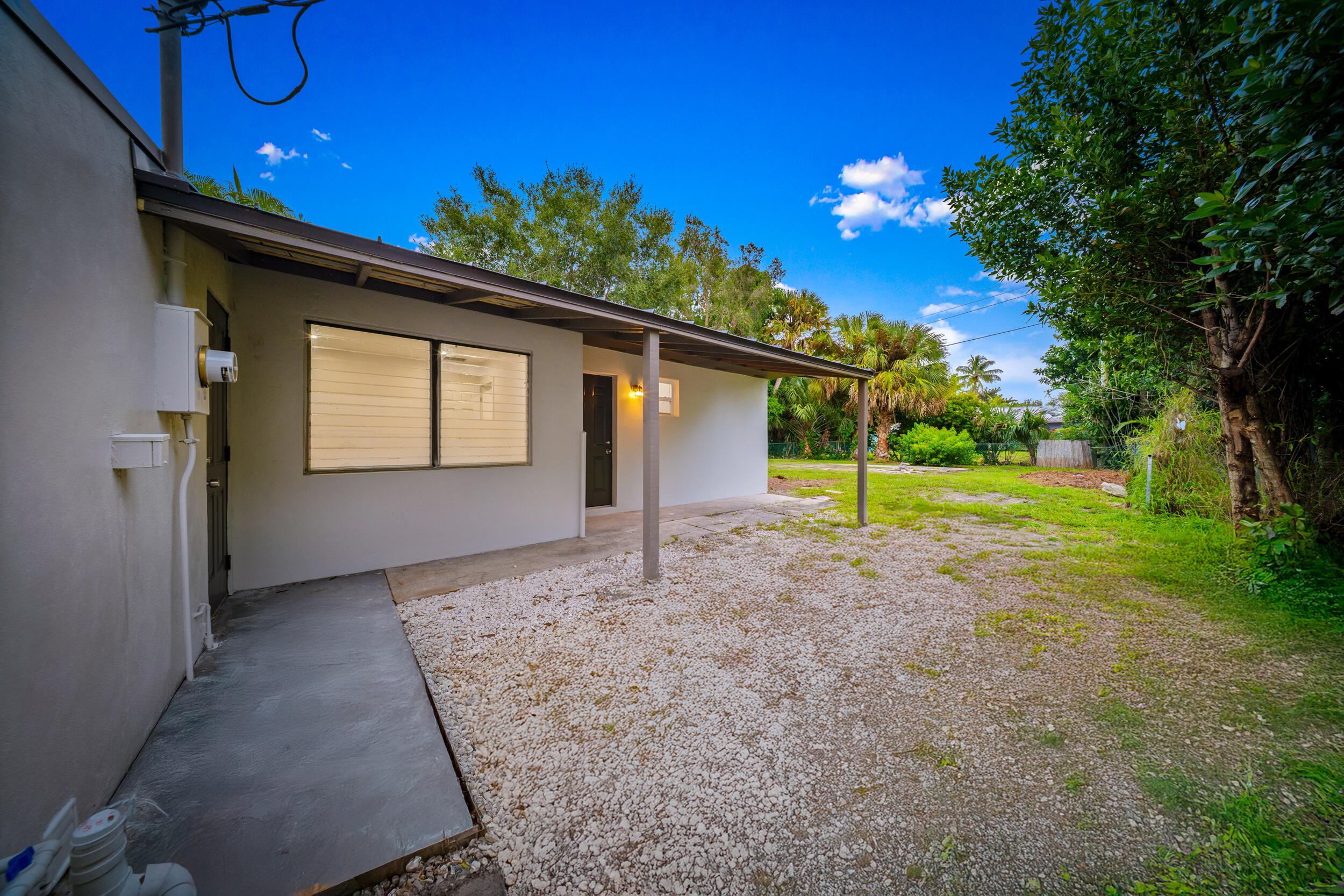 2904 Southeast Bamboo Street Stuart, FL 34997 - Photo 31 of 51 a view of a house with a tree