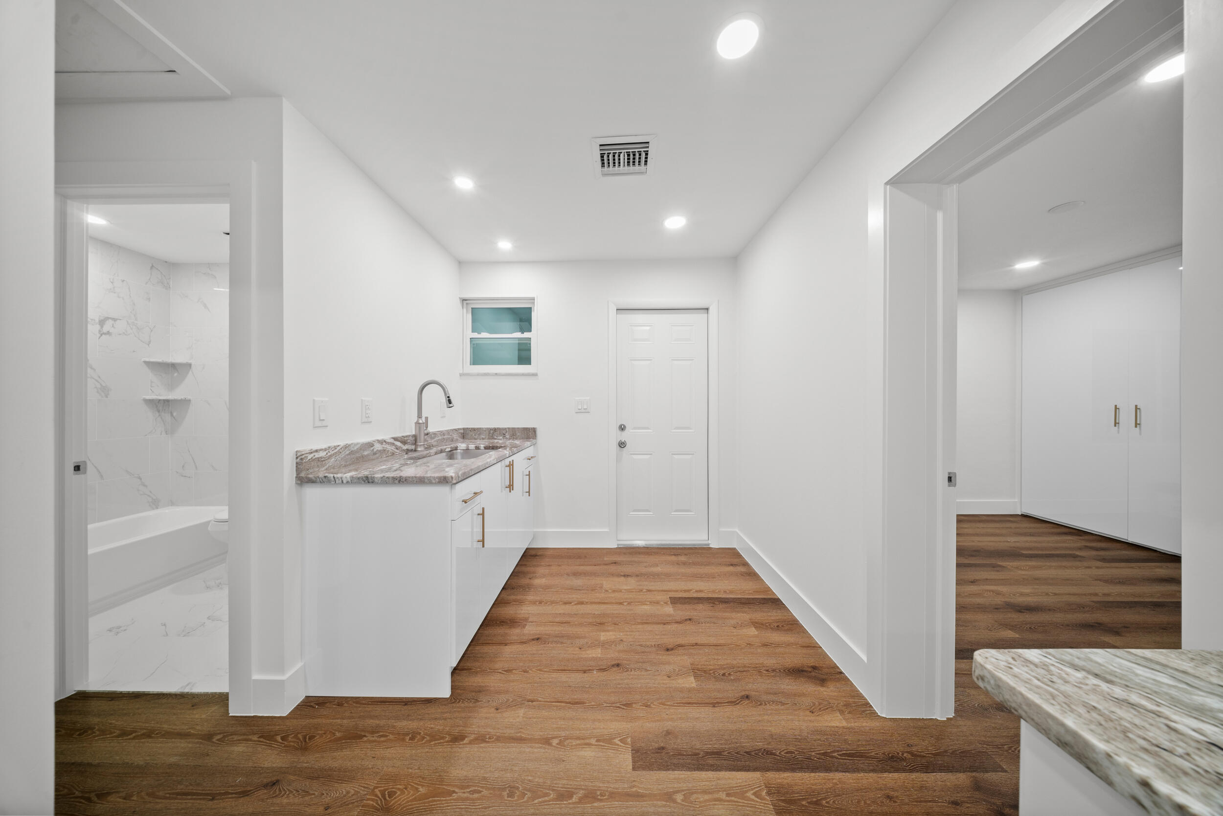 2904 Southeast Bamboo Street Stuart, FL 34997 - Photo 40 of 51 a bathroom with a granite countertop sink and a mirror