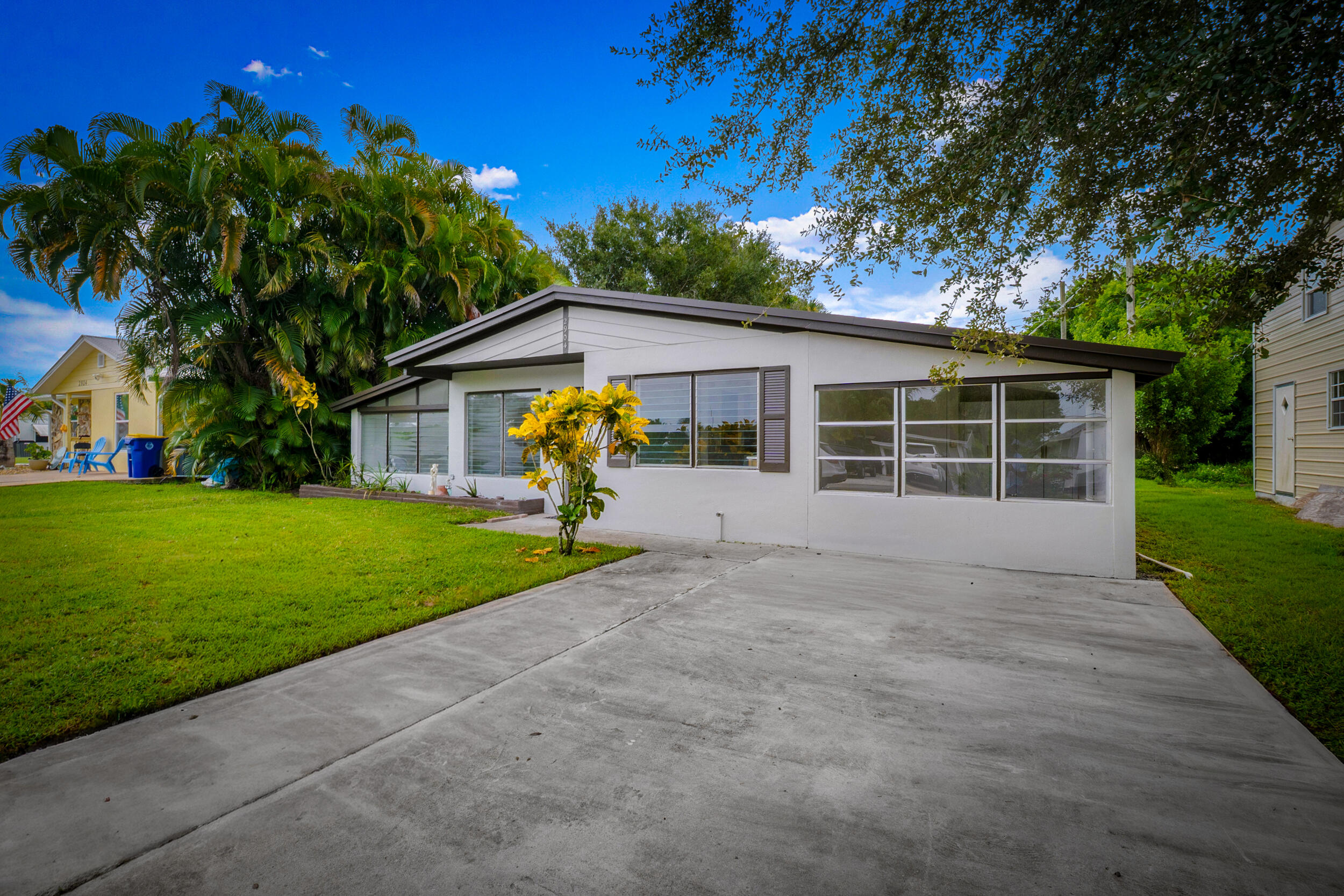 2904 Southeast Bamboo Street Stuart, FL 34997 - Photo 4 of 51 a view of a house with a yard