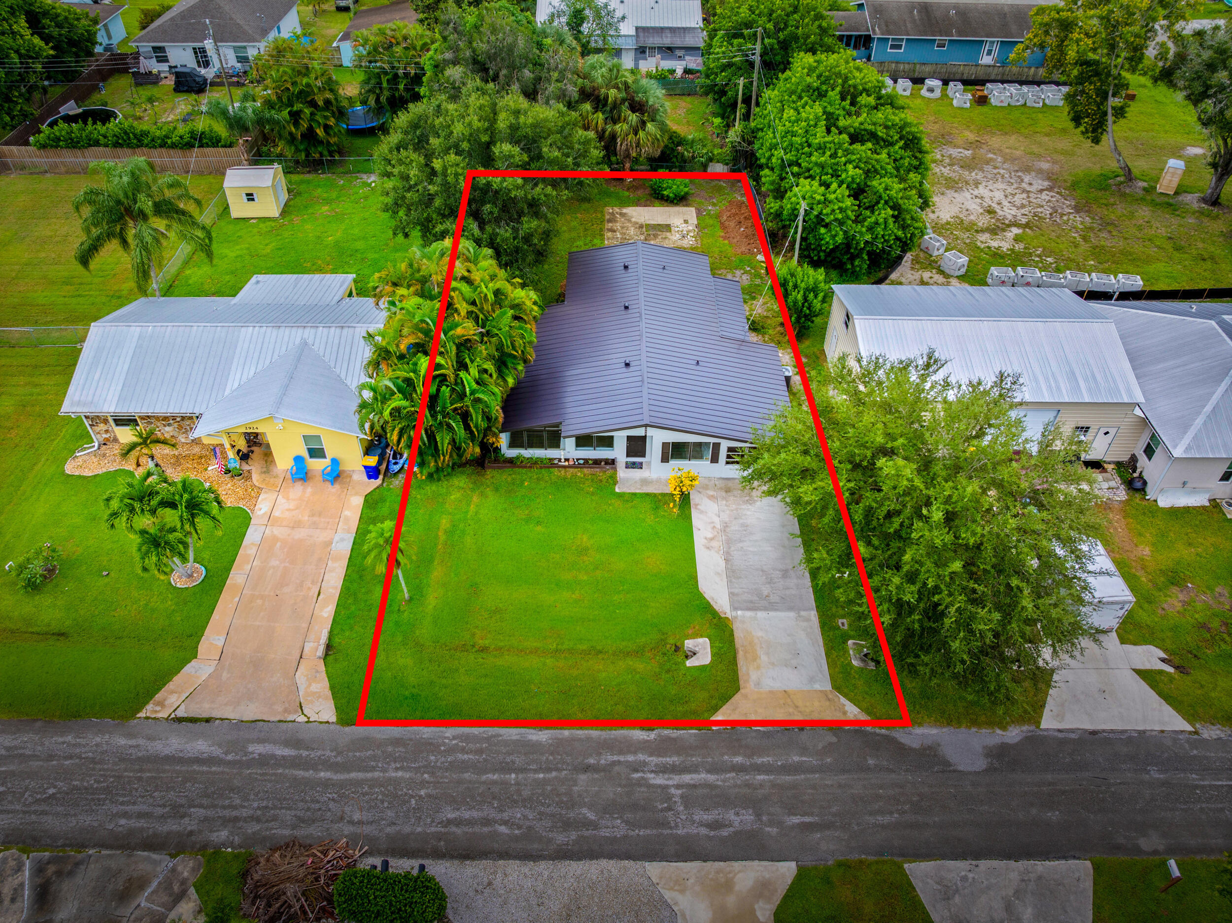 2904 Southeast Bamboo Street Stuart, FL 34997 - Photo 46 of 51 an aerial view of multiple houses with yard