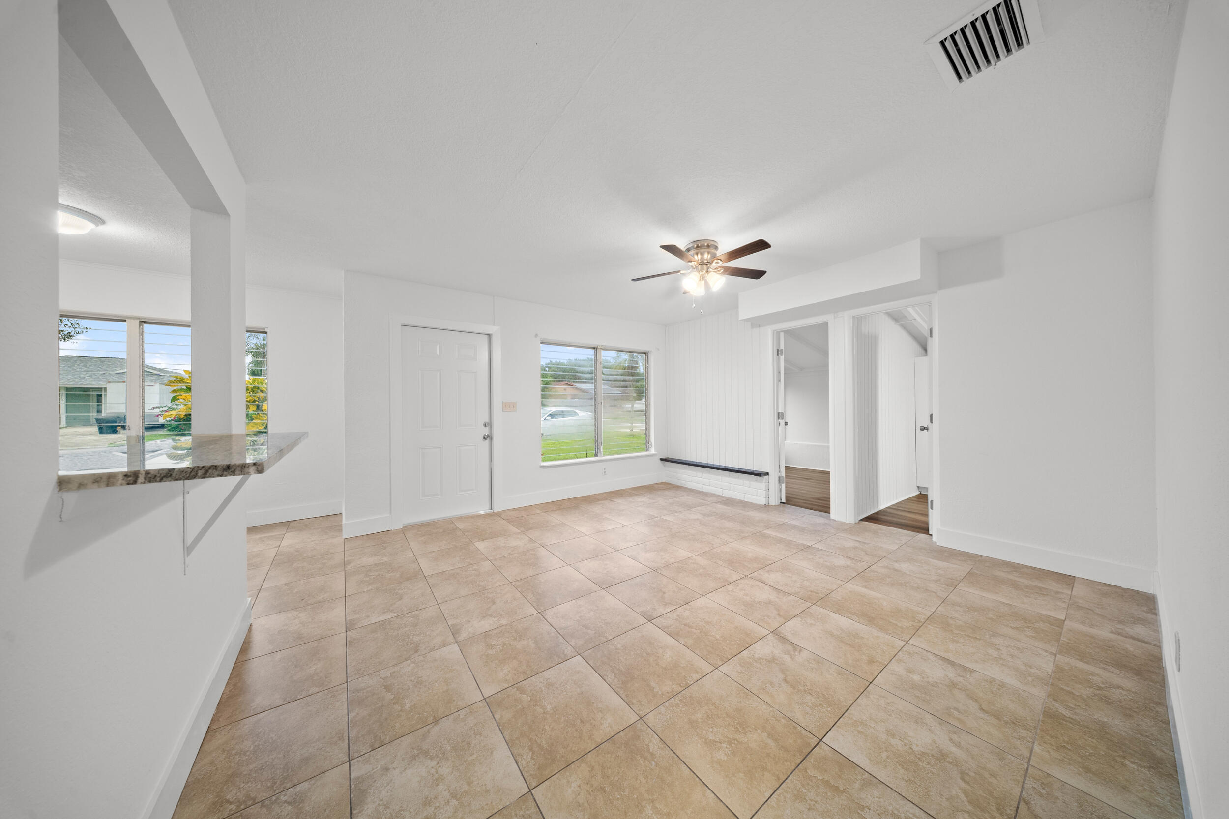 2904 Southeast Bamboo Street Stuart, FL 34997 - Photo 7 of 51 a view of an empty room with a bathroom