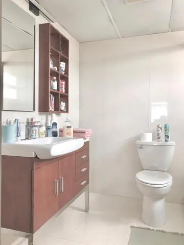 a bedroom with a bed and a table