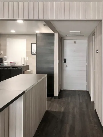 a bathroom with a walk in closet