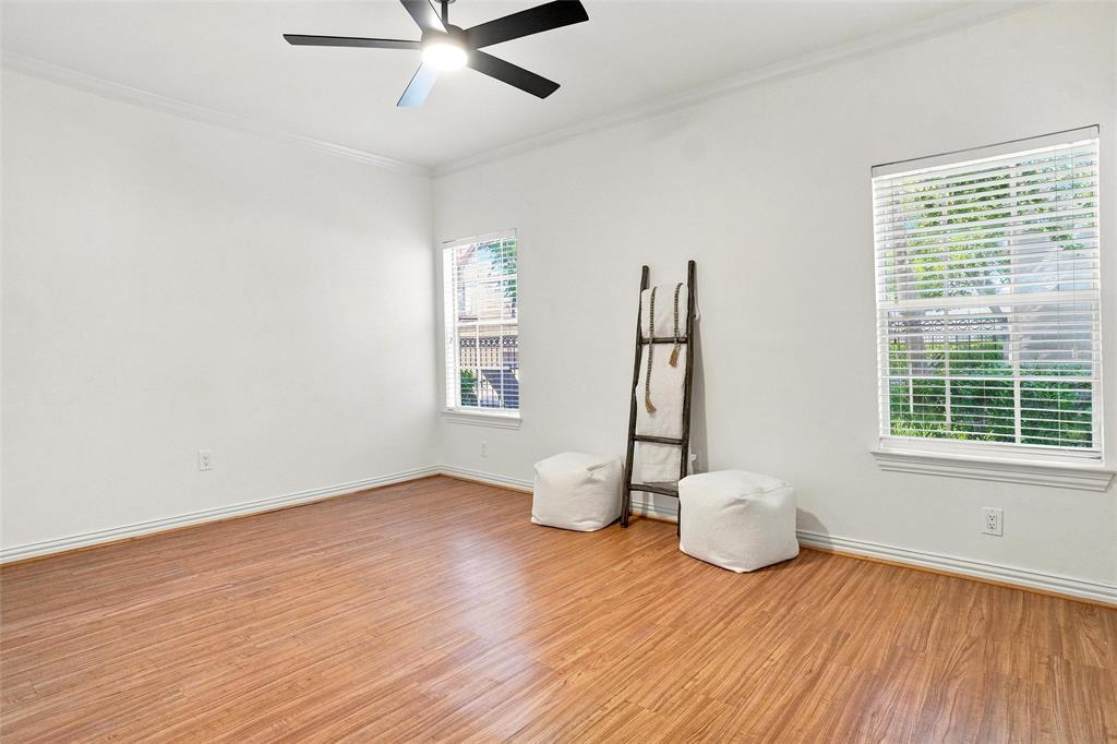 2601 Preston Road, Unit 4103 Plano, TX 75093 - Photo 9 of 16 Wood-finish flooring, white walls, and crown molding