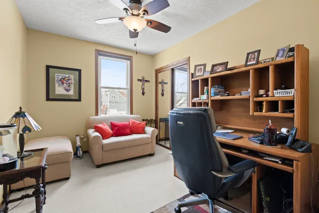 a living room with furniture and flat screen tv
