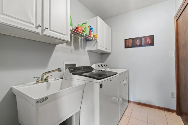 a kitchen with stainless steel appliances a sink and a stove