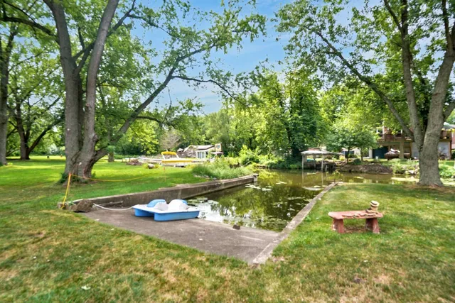 a view of the house with snow on the road