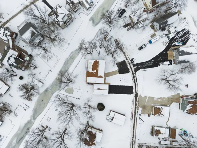 an aerial view of a house with a lot of residential buildings