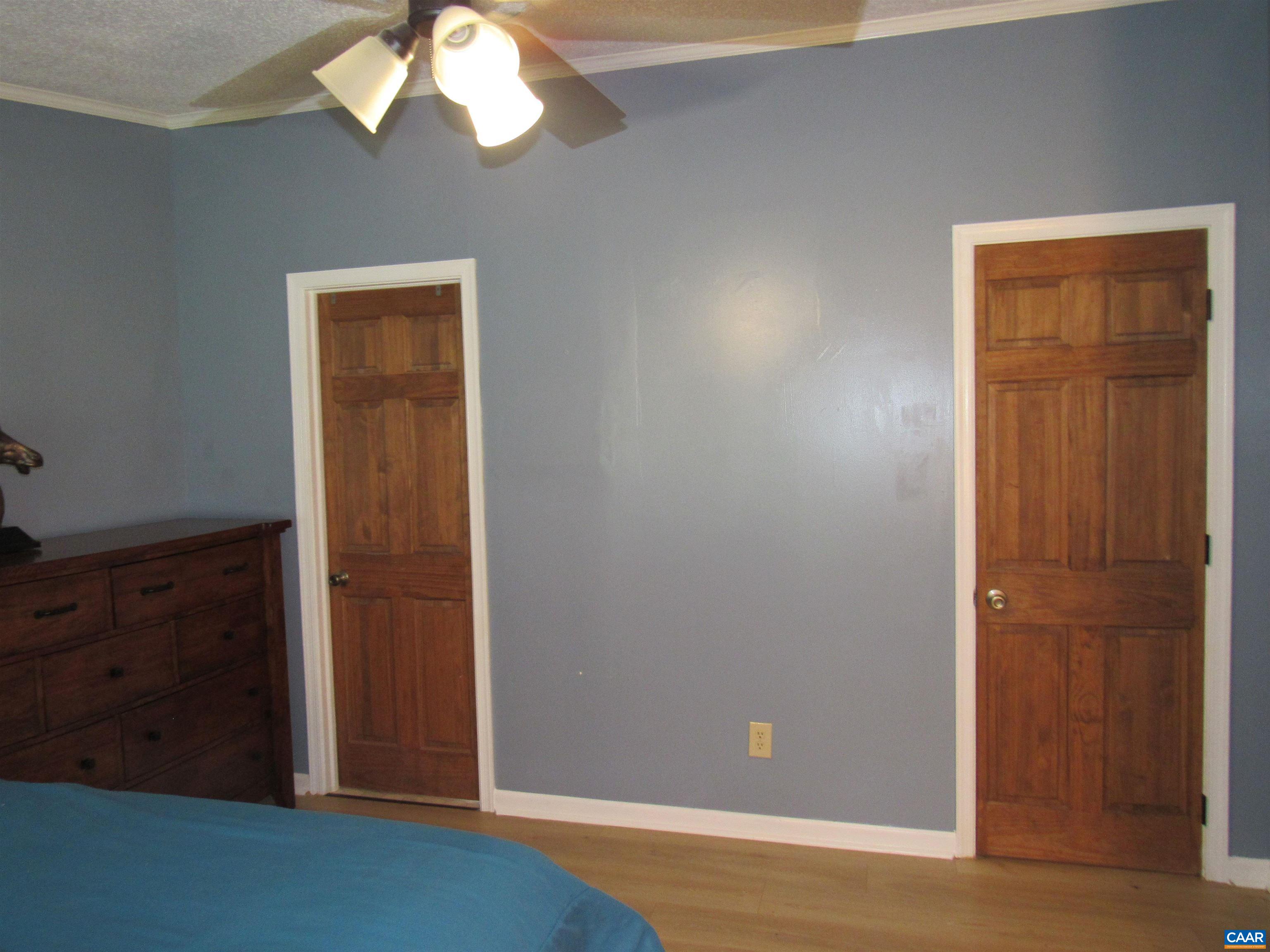 1992 Jerusalem Church Road Buckingham, VA 23921 - Photo 15 of 33 an empty room with wooden floor cabinet and windows