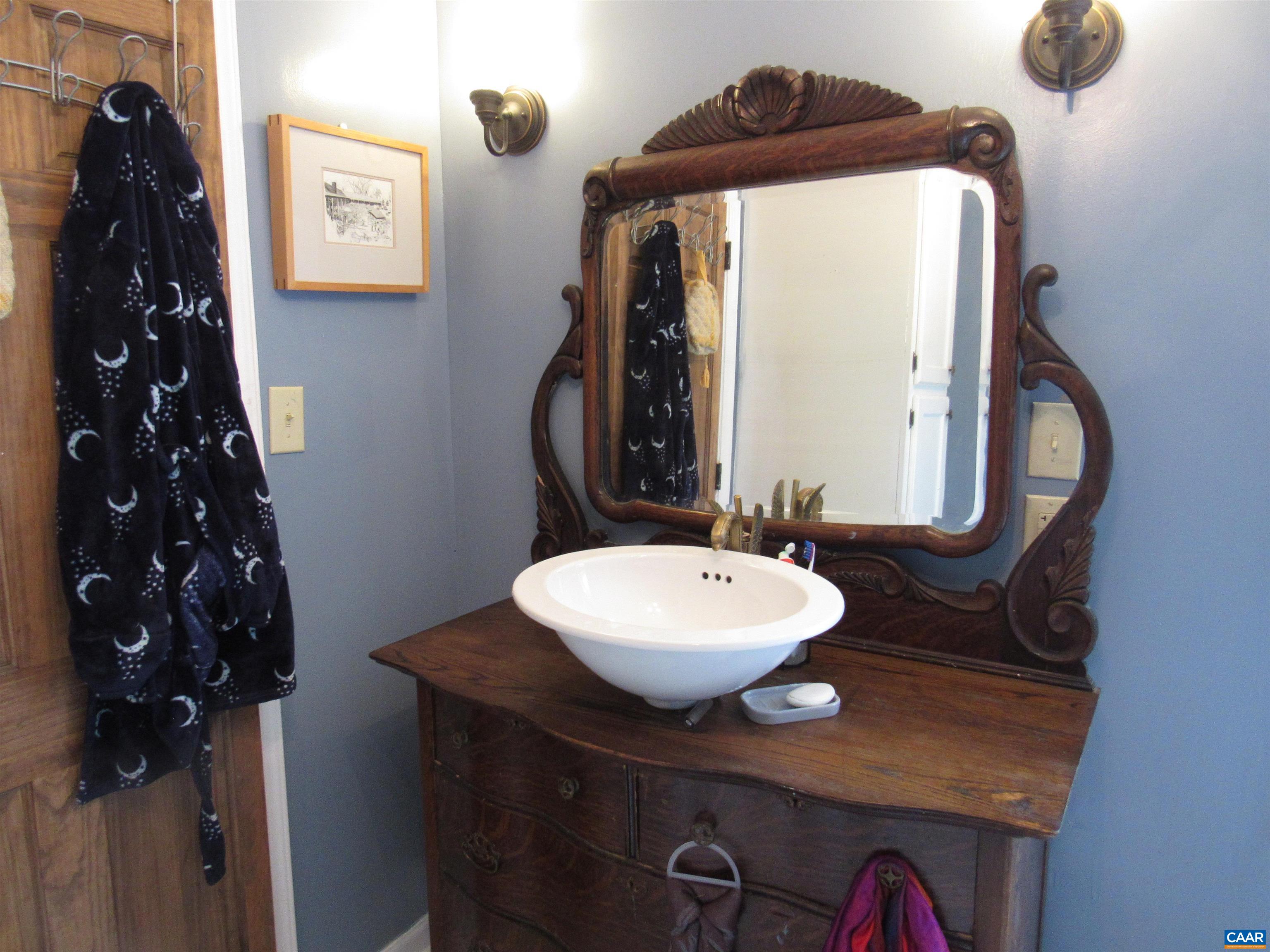 1992 Jerusalem Church Road Buckingham, VA 23921 - Photo 18 of 33 a bathroom with a toilet a sink and mirror