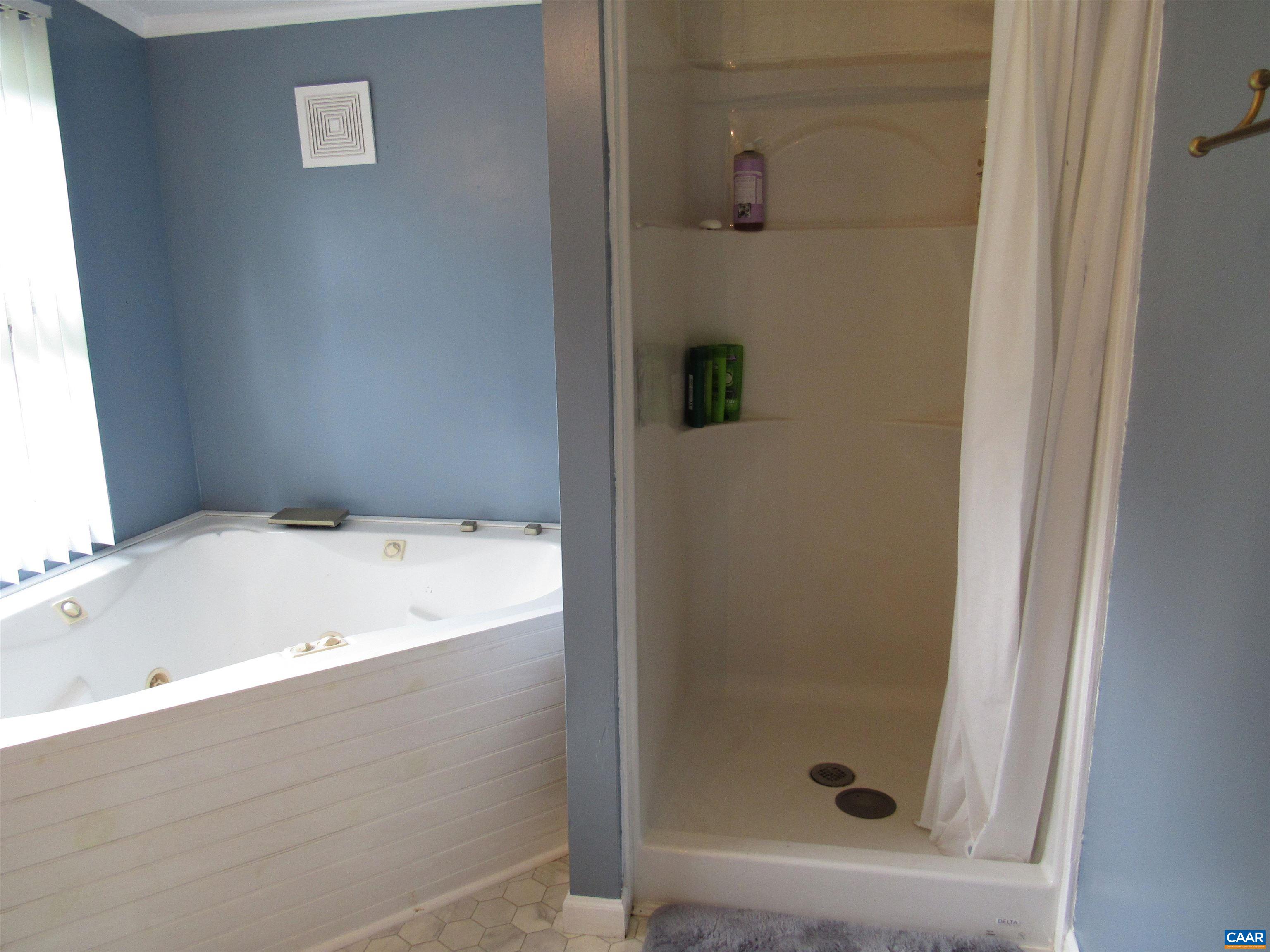 1992 Jerusalem Church Road Buckingham, VA 23921 - Photo 20 of 33 a bathroom with a tub and shower