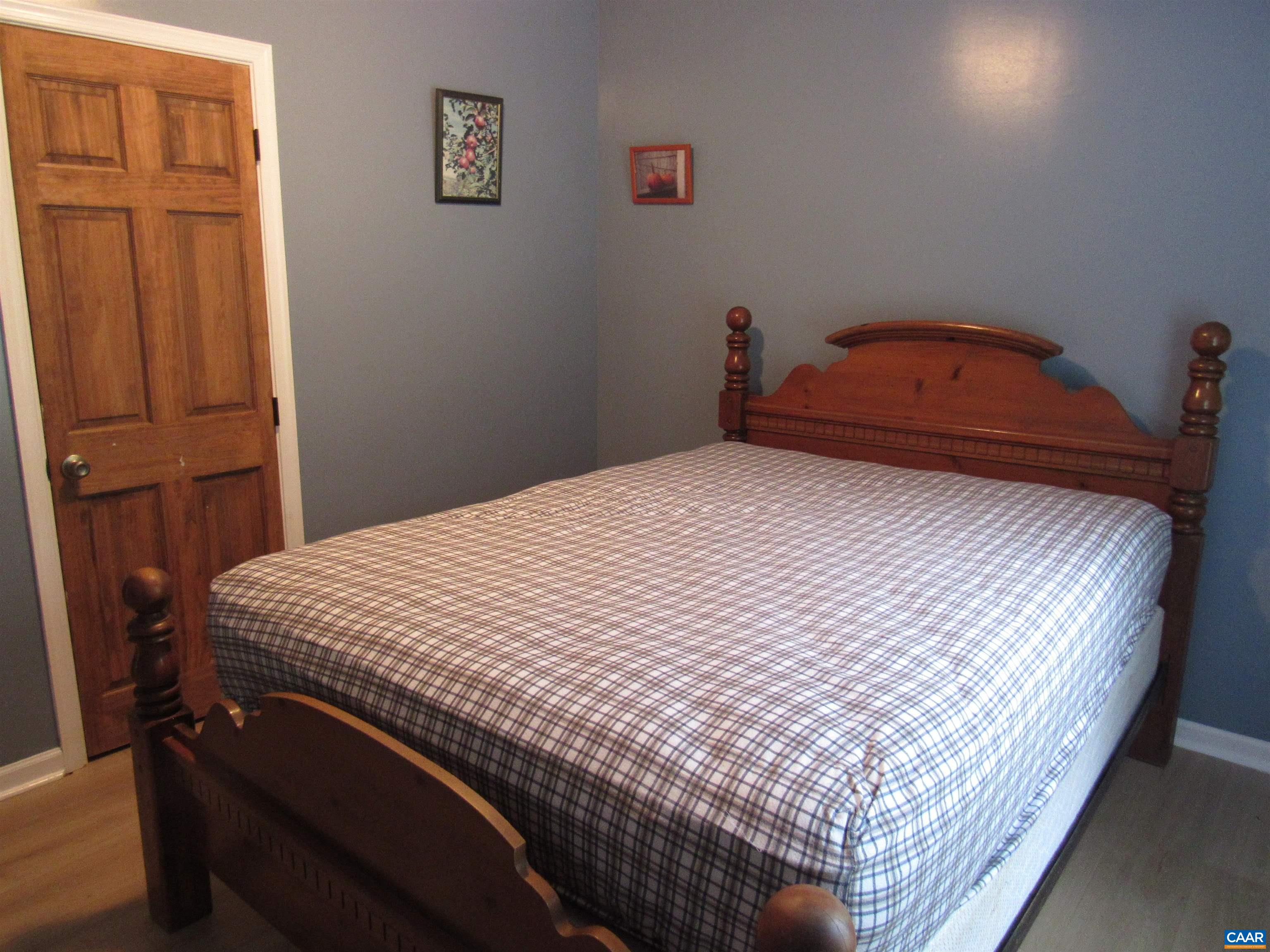 1992 Jerusalem Church Road Buckingham, VA 23921 - Photo 22 of 33 a bedroom with a bed and wooden floor