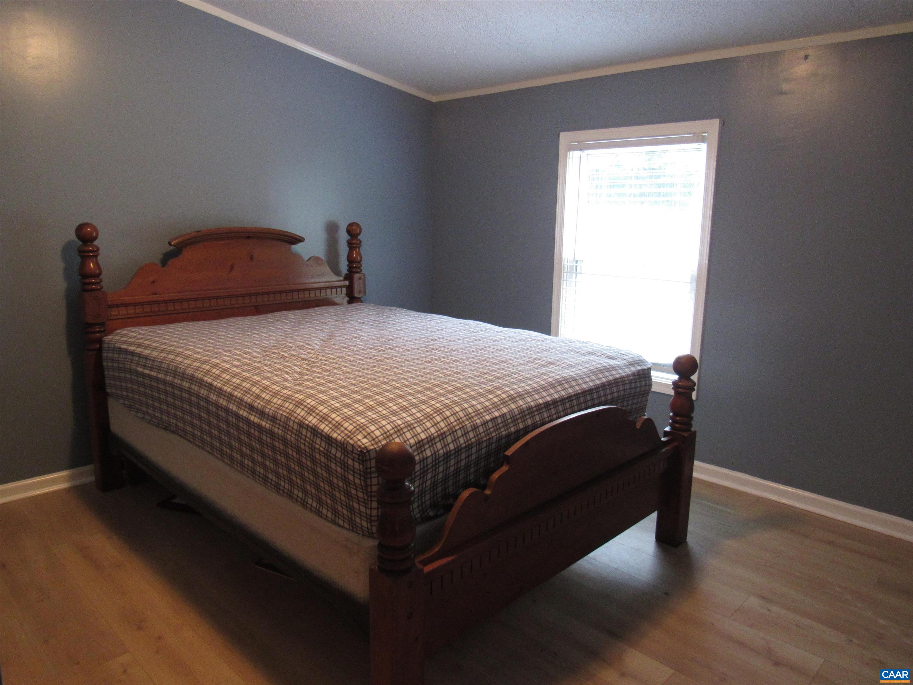 1992 Jerusalem Church Road Buckingham, VA 23921 - Photo 23 of 33 a bedroom with a bed and wooden floor