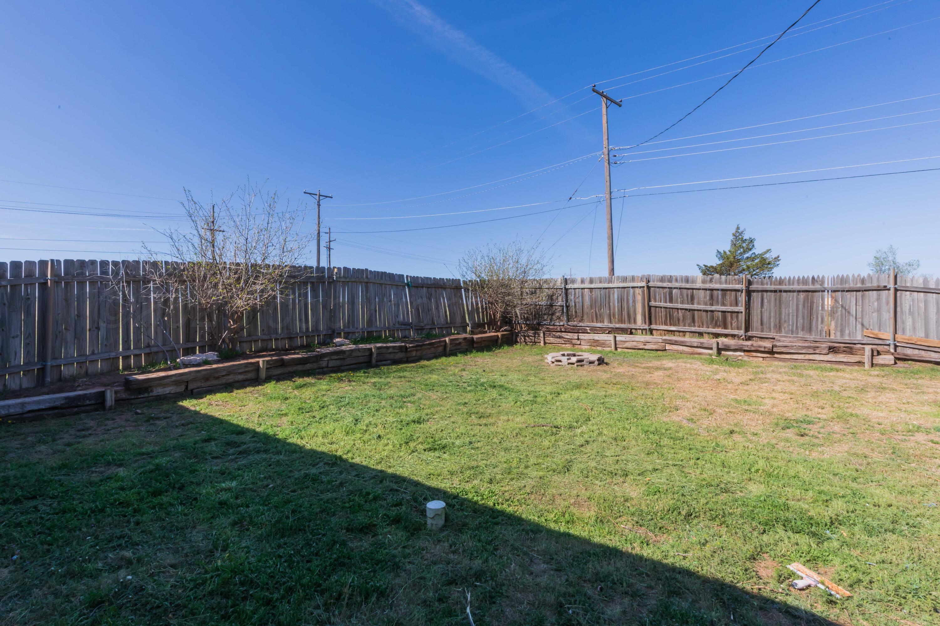 105 Poplar Street Skellytown, TX 79080 - Photo 35 of 37 a view of a backyard with a small pool