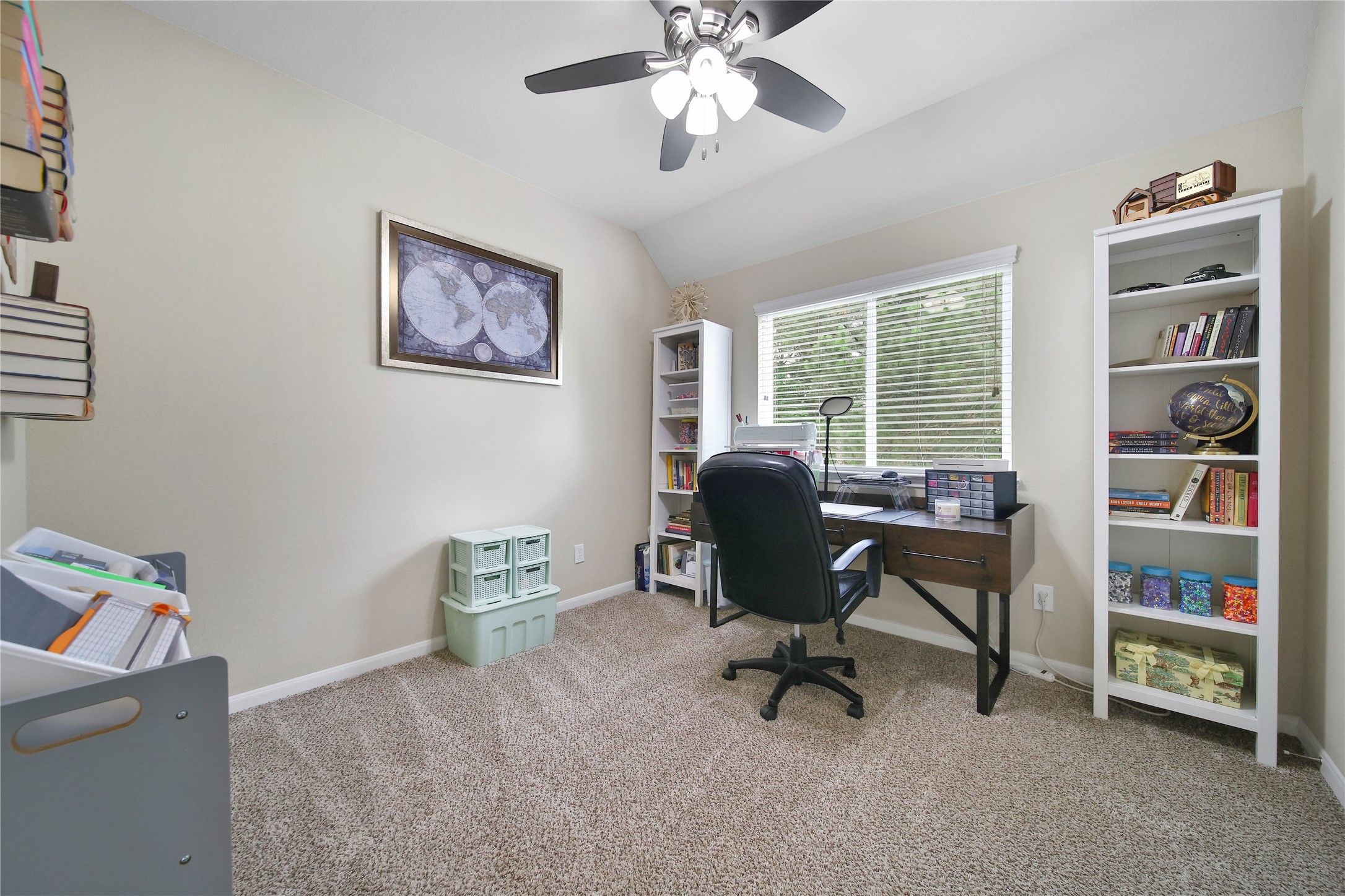 9223 Wapiti Trail Conroe, TX 77303 - Photo 35 of 45 a view of a workspace with furniture and a window
