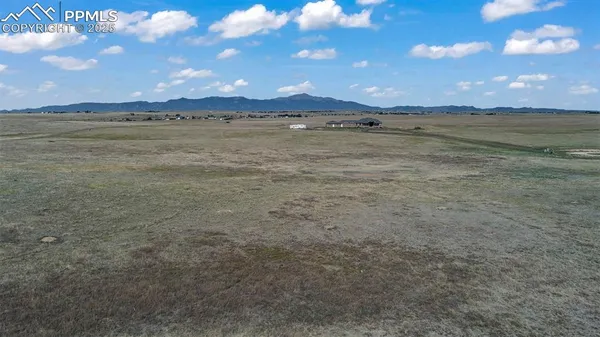a view of an ocean and a yard