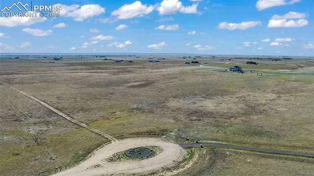 a view of a dry yard with an ocean beach