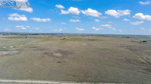 a view of an ocean and yard
