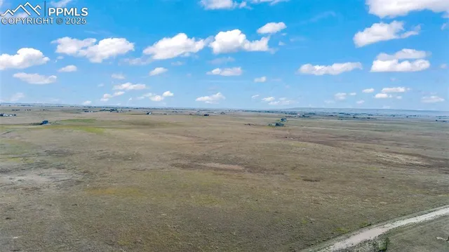 a view of an ocean and a yard