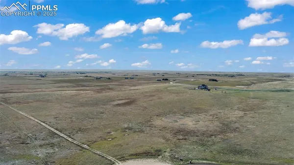 a view of an ocean beach and a yard