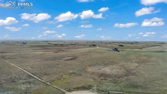 a view of an ocean beach and a yard