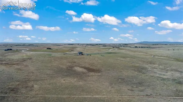 a view of an ocean beach and a yard