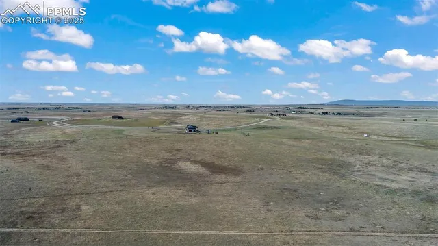 a view of an ocean beach and a yard