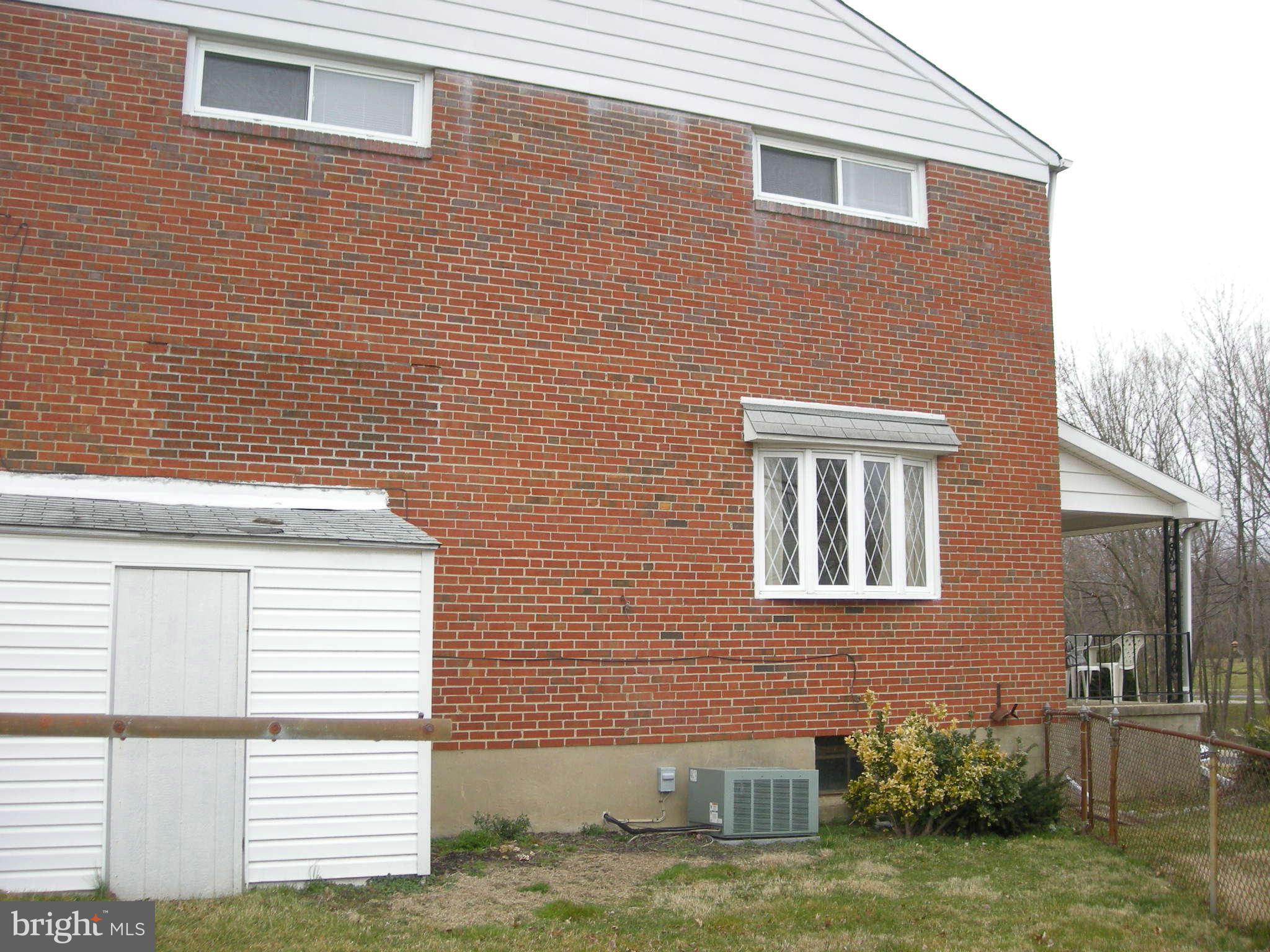 8599 Morven Road Baltimore, MD 21234 - Photo 3 of 18 Side of home and storage shed