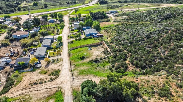 an aerial view of a house with mountain view