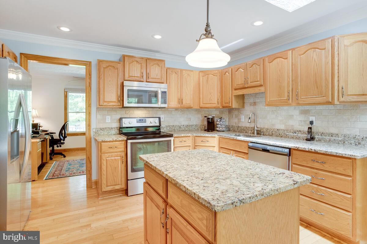 8429 Bussenius Road Pasadena, MD 21122 - Photo 20 of 46 Updated Kitchen Boasting Granite Counters & Island